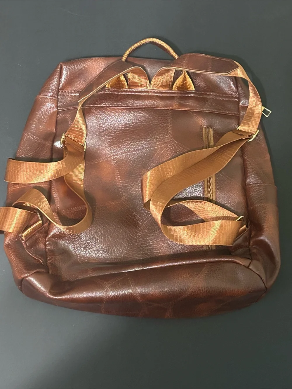 Woman’s Brown Faux Leather Backpack with Green Stud Accents